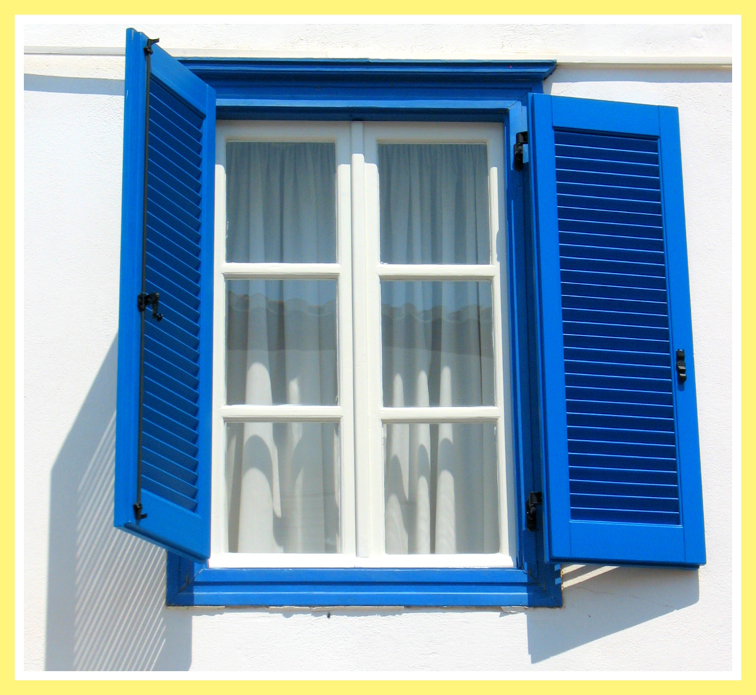 blue shuttered window